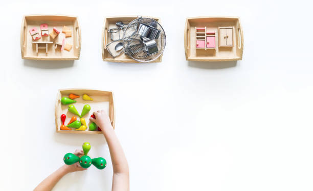 istock Montessori material flat lay. Copy space Children hand Collage color rainbow 1305914924