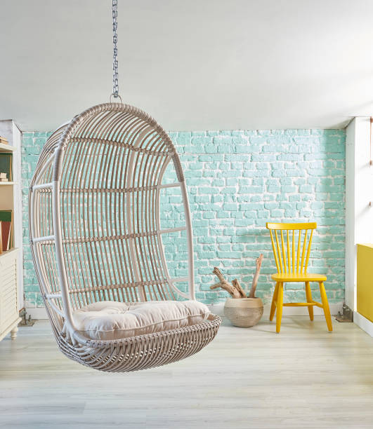 istock modern living room interior with bookshelf swinging seat 1305915826