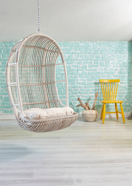 istock modern living room interior with bookshelf swinging seat 1305915846