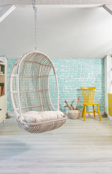 istock modern living room interior with bookshelf swinging seat 1305915877