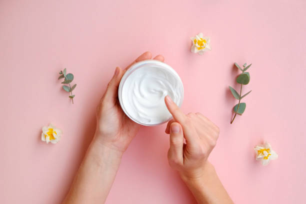 istock Cosmetic products on textured background. 1305916127