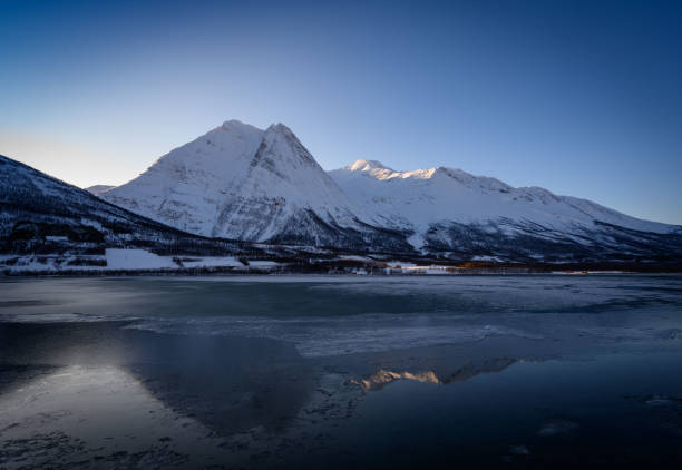 istock Winter Fugltinden mountain with reflection in Northern Norway 1305923236
