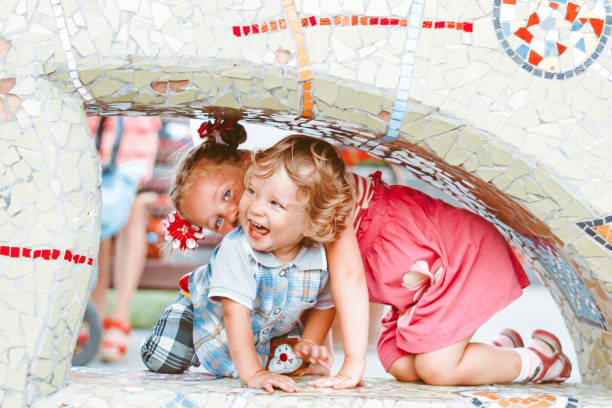 istock children play in the park 1305923998