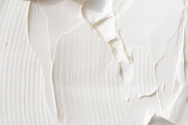 white cream close up texture white cream close up texture with selective focus lotion texture stock pictures, royalty-free photos & images