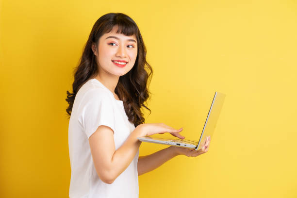 istock Woman holding laptop 1305927045