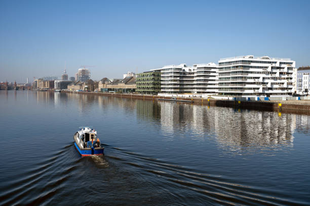 boat on spree river at modern business and residential distric in berlin
