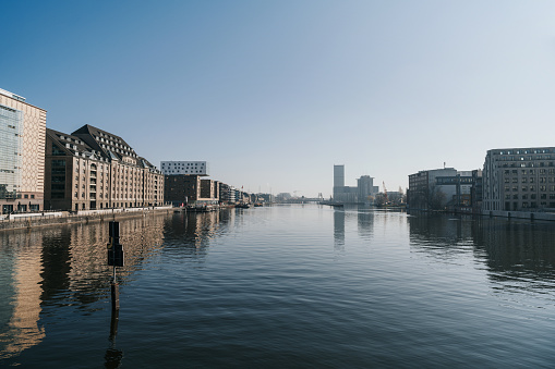 view from Oberbaumbrücke on spree river in business and residential district in berlin at sunny day