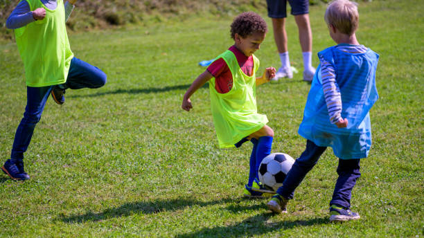 istock Children playing match on soccer field 1305932134
