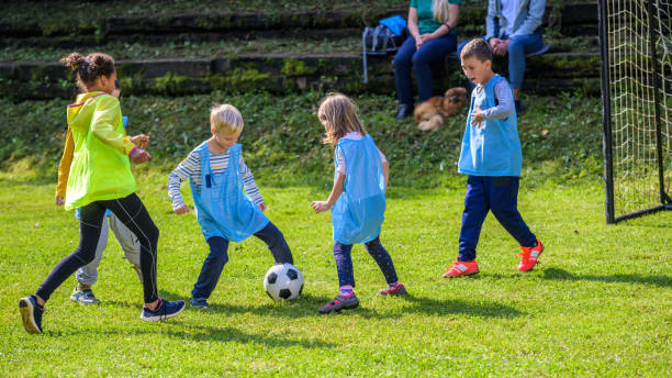 istock Children playing match on soccer field 1305932250