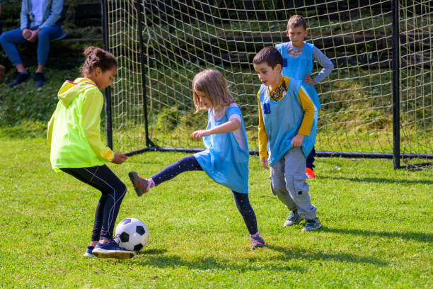 istock Children playing match on soccer field 1305932260