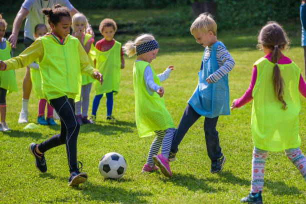 istock Children playing match on soccer field 1305932276