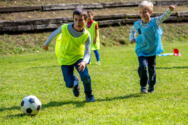 istock Children playing match on soccer field 1305932469