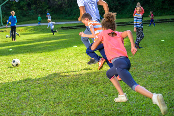 istock Children practising soccer with coach 1305933533