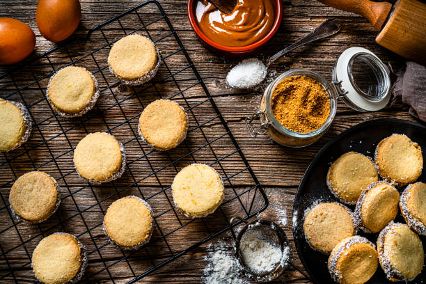 alfajores. traditional argentinian cookies with dulce de leche - milk old fashioned retro revival still life imagens e fotografias de stock