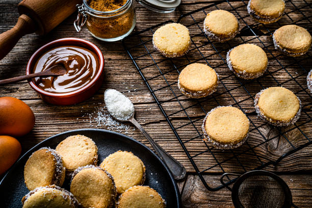 alfajores. traditional argentinian cookies with dulce de leche - milk old fashioned retro revival still life imagens e fotografias de stock