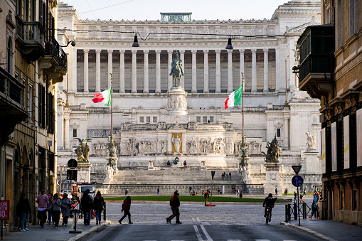 Rome, Italy, February 26 -- The Altare della Patria National Monument, in the heart of the Eternal City near the Roman Forum, in a view from Via del Corso boulevard. The Altare della Patria, or Vittoriano, was built in 1885 in honor of the first King of Italy, Vittorio Emanuele II. Inside there is the Unknown Soldier grave, the War Memorial Monument dedicated to all Italian soldiers who died in wars. The Altare della Patria is the scene of all the official Italian celebrations, in particular the National Day of the Republic on June 2nd and the Liberation Day on April 25th. Image in high definition format.
