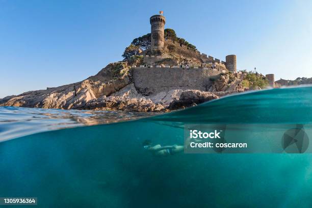 Little Boy Snorkeling With A Castle In The Background Stock Photo - Download Image Now