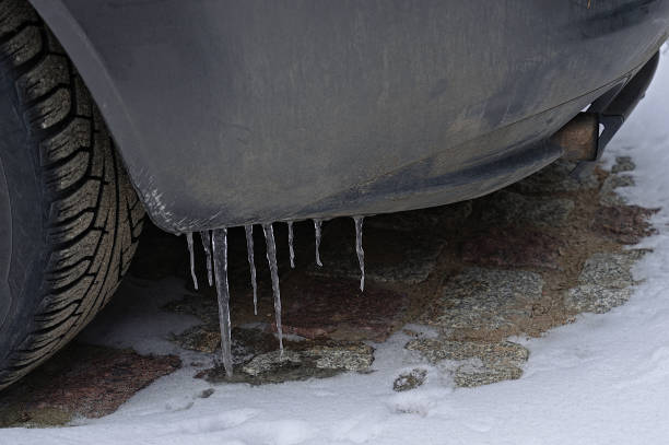 istock Closeup on icicles ice hanging on the car 1305936671
