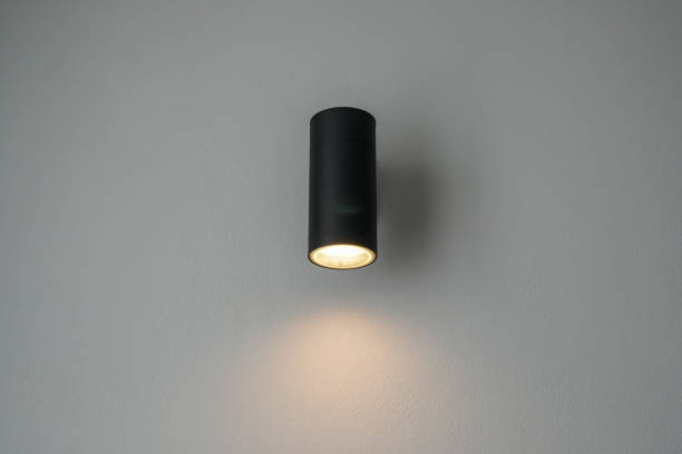 istock modern minimal warm light bulb on the bedroom wall 1305936761