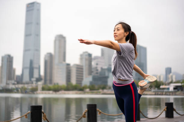 istock Asian woman streching her body before exercising 1305937675