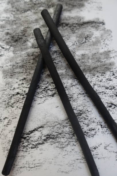 istock Black charcoal on a sheet of drawing paper 1305937759