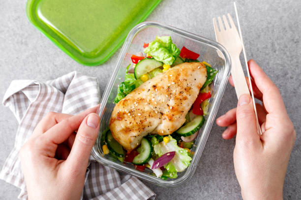 istock lunch box of vegetable salad with grilled chicken breast 1305938532