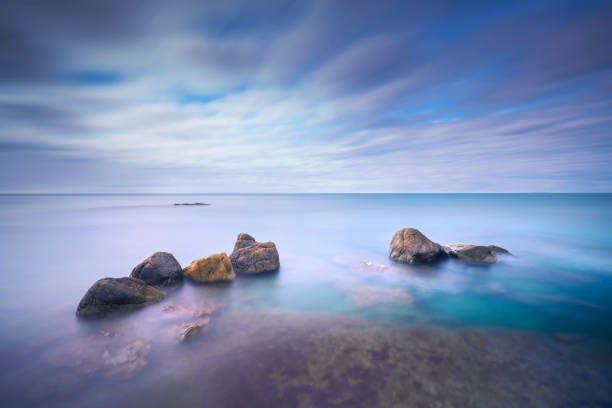 istock Rocks and soft sea, long exposure photography landscape. 1305939921