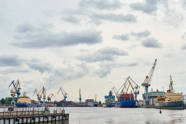 istock working crane bridge in shipyard and cargo ships in a port 1305941640