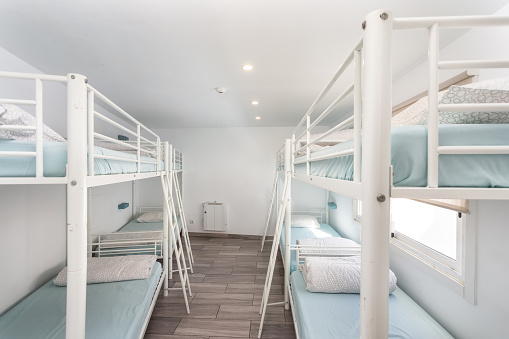Clean bedroom with bunk beds in a hotel, a hostel for tourists