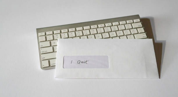 istock I quit letter inside white envelope on top of keyboard. Employee resignation concept. 1305942222