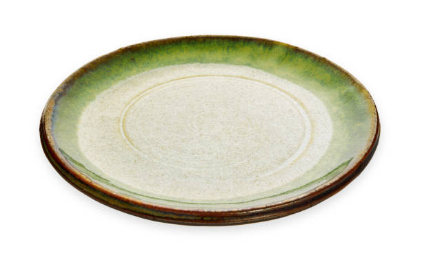 istock Green ceramic plate, Empty plate with granite texture, isolated on white background with clipping path, Side view 1305943333