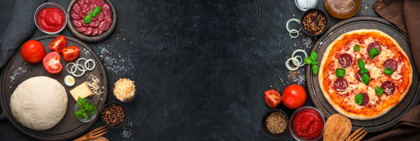 istock Raw ingredients and ready-made pizza on a black background 1305944956