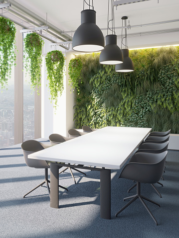 Industrial space of a modern meeting room with vertical garden, hanging plants in an offices building