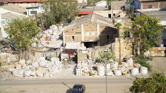 04 March 2021-Metro city, Jaipur, India. Ancient factory of White cement near Jaipur Rajasthan. Plastic sacs full of white cement.