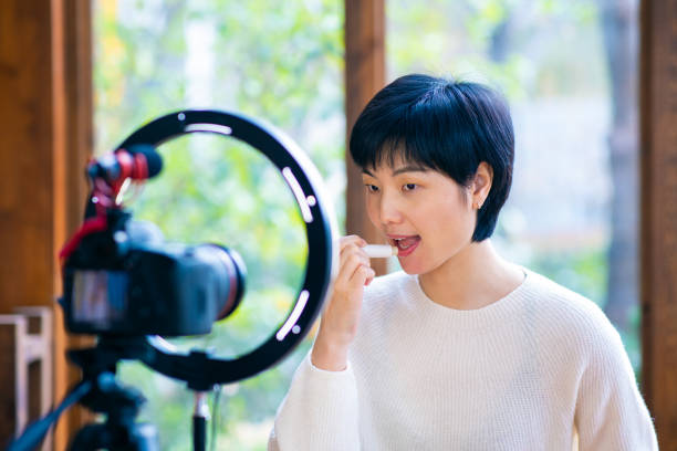 istock Asian woman blogger recording make up tutorial video 1305947336