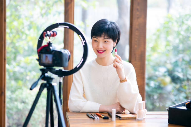 istock Asian woman blogger recording make up tutorial video 1305947366