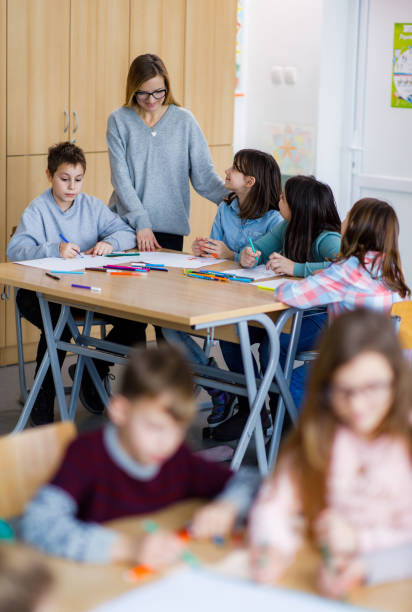 istock Children drawing whit felt tip pens in the classroom 1305948579