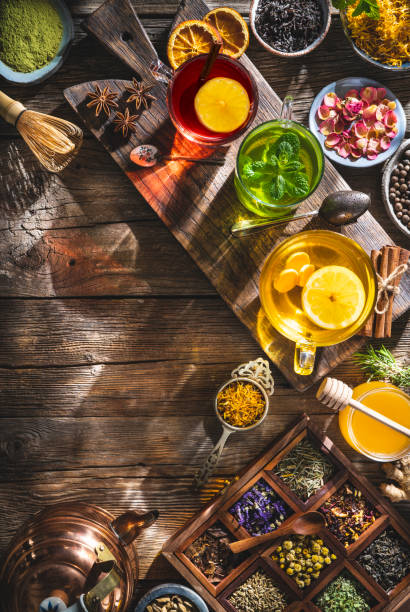 istock Tea and herbal infusion with dried herbs on wooden rustic table board 1305948608