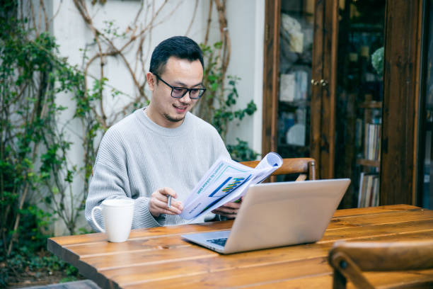 istock Asian man working outdoors 1305948644
