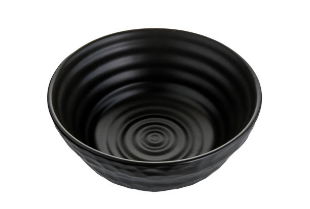 istock Black ceramic bowl, Empty black bowl with rough texture isolated on white background with clipping path, Side view 1305948939