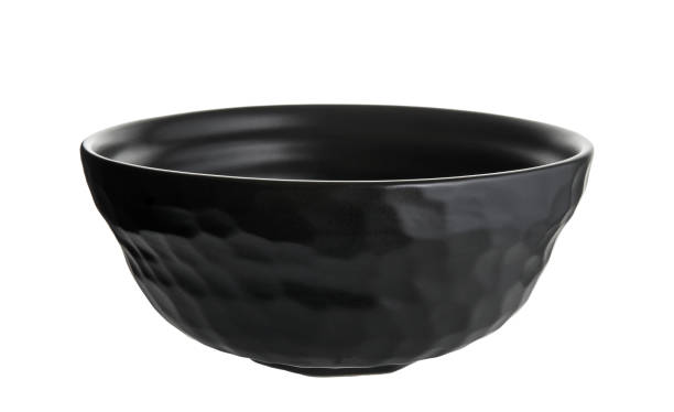 istock Black ceramic bowl, Empty black bowl with rough texture isolated on white background with clipping path, Side view 1305949117