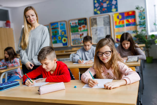 istock Children writing a dictation on a class in the classroom 1305949273
