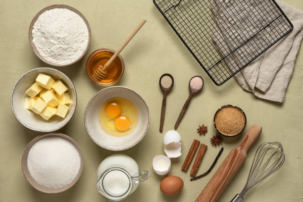 istock Table with baking ingredients. Plaster beige background. View from above. 1305952658