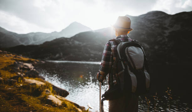 istock Watching lake at sunset during hiking activities 1305955507