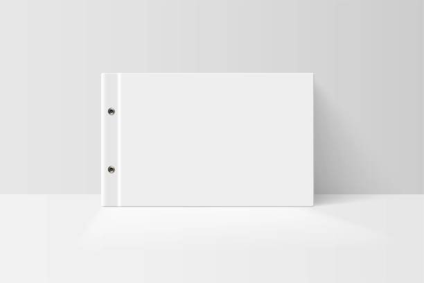 istock Booklet or notebook mock up. Blank white cover of book vector illustration. Softcover of white catalog, album or journal design presentation 1305956557