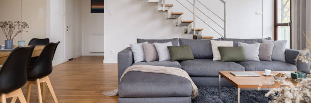 istock Spacious living room with stairs, panorama 1305956725