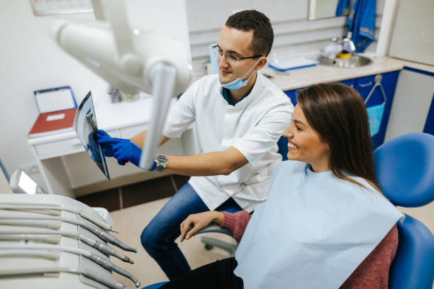 istock Young female patient at the dentist's office 1305956990