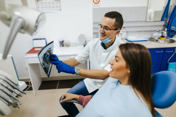 istock Young female patient at the dentist's office 1305957008