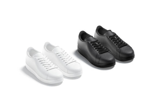 istock Blank black and white leather sneakers with lace mockup, isolated 1305959041