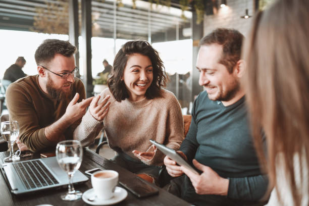istock Friends Laughing While Discussing Different Prices In Their Living Places During Coffee Time 1305959529